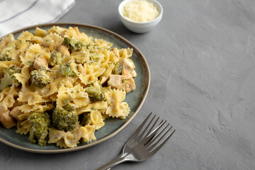Homemade One-Pot Creamy Chicken and Broccoli Pasta on a Plate, side view. Copy space.