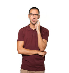 Concerned young man making a gesture of doubt