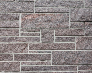 Rectangular Stone Wall of Rose and Tan Colored Stone for Background