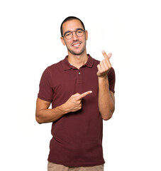 Young man making a gesture of worried about his economy