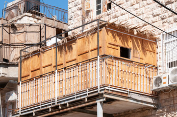 A wooden sukkah, a temporary structure used as a home as part of the observance of Sukkot, a weeklong Jewish holiday celebrated in the Hebrew month of Tishrei.
