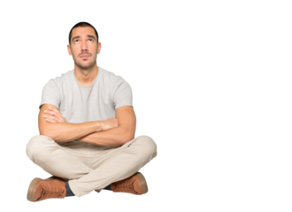 Serious young man looking against background