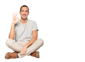 Happy young man doing an all right gesture