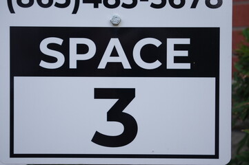 Fototapeta premium Sign with numbers for parking spots