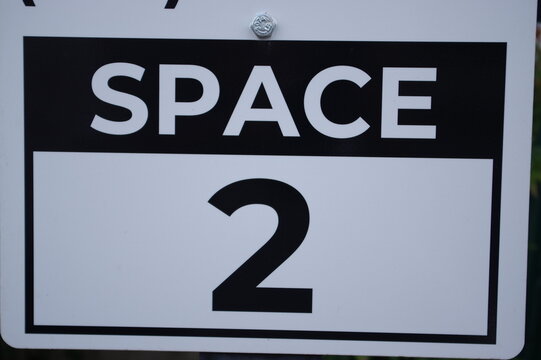 Sign With Numbers For Parking Spots