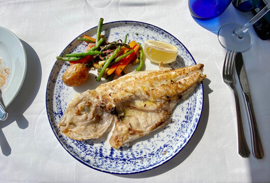 plate of grilled fish and vegetables