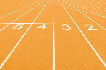 Yellow track and field lanes and numbers. Running lanes at a track and field athletic center....