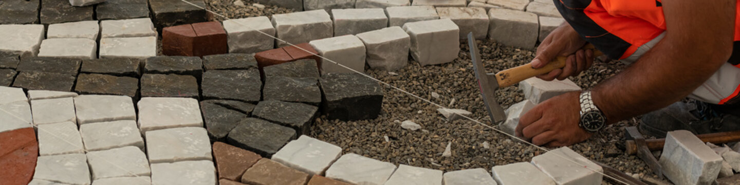 Garden Brick Pathway Paving by Professional Paver Worker.