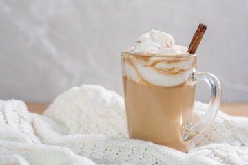 Pumpkin latte in a glasses. Autumn drink for Halloween or Thanksgiving.