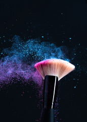Colored makeup powder on black background