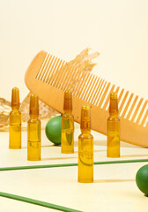 Modern Creative still life photo. Cosmetic ampoules with serum for hair growth, restoration. Hair...