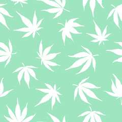 Fototapeta na wymiar Seamless pattern of white cannabis leaves on a green background. White hemp leaves on a blue background. 