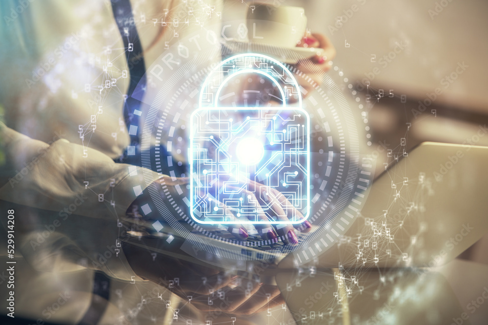 Poster double exposure of woman hands working on computer and lock hologram drawing. security concept.