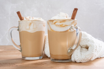 Pumpkin latte in a glasses. Autumn drink for Halloween or Thanksgiving.