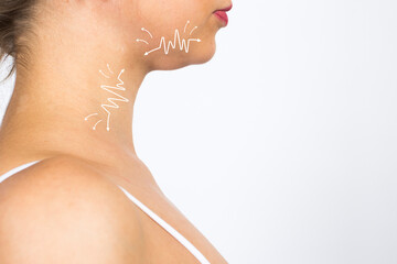 Cellulite removal scheme. White arrows markings on face and chin young girl closeup.