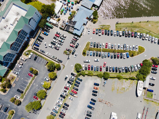 View of the parking for cars and yachts near the bay with the marina, View from above.