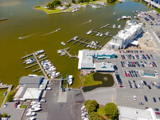 view to hotels parking with cars and yachts. View from above.
