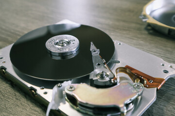 Disassembled computer hard drive. Data hard drive backup disc hdd disk restoration. Disassembled...
