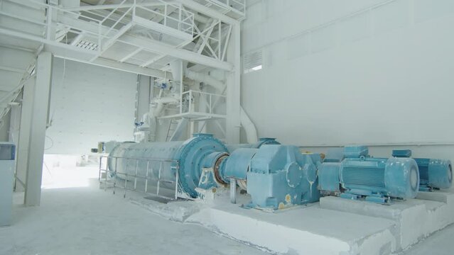 Overview of modern machinery equipment grinding natural stone at industrial stone processing factory