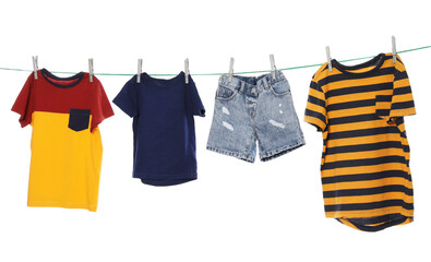 Different clothes drying on washing line against white background