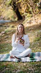 spiritual woman playing tibetan bowls for meditation, alternative medicine