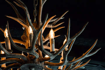 Wooden chandelier in a shape of antlers