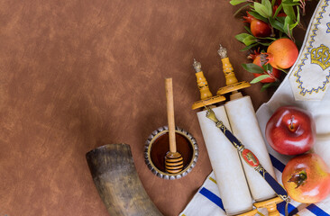 Traditional Jewish New Year symbols include apple, honey, pomegranate and shofar during the Jewish...