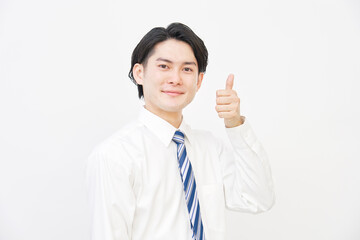 白背景で両手でグッドサインするビジネスマン