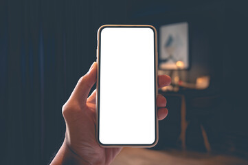 Close up men using a smartphone with an empty white screen at home.