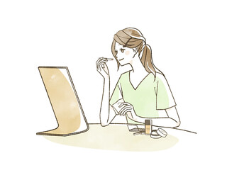 メイクをしている女性