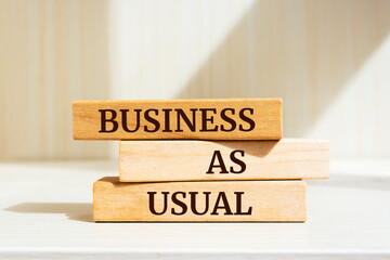 Wooden blocks with words 'Business as Usual'. Business concept