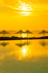 umbrella with bed pool around swimming pool with ocean sea background