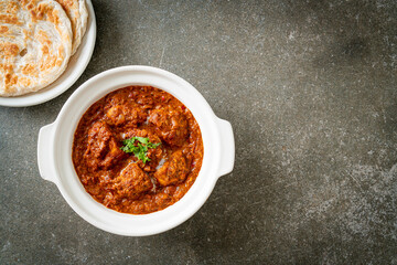 chicken tikka masala spicy curry meat food with roti or naan bread