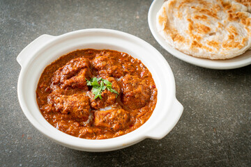 chicken tikka masala spicy curry meat food with roti or naan bread