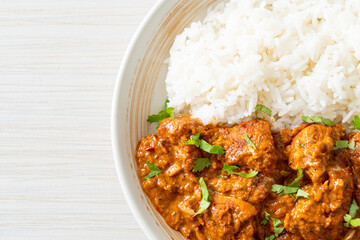 chicken tikka masala with rice on plate