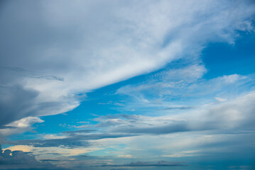 Obraz premium Blue sky fluffy white clouds on summer season bright clear skyline with beautiful cloudscape. Panorama blue sky clouds pattern on daylight with copy space. Cumulus cloudscape air climate sunny day