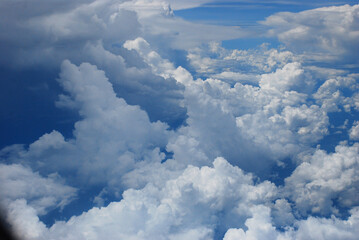 Fototapeta premium Blue sky fluffy white clouds on summer season bright clear skyline with beautiful cloudscape. Panorama blue sky clouds pattern on daylight with copy space. Cumulus cloudscape air climate sunny day