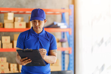 Holding clipboard, Warehouse asian man manager workers checking packages box and supplies with...
