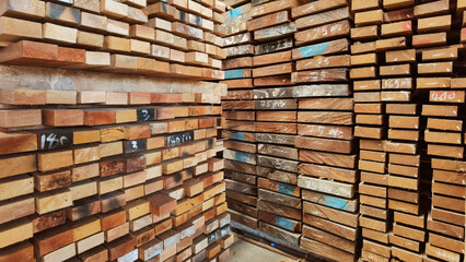 Piles of wooden boards in the warehouse 