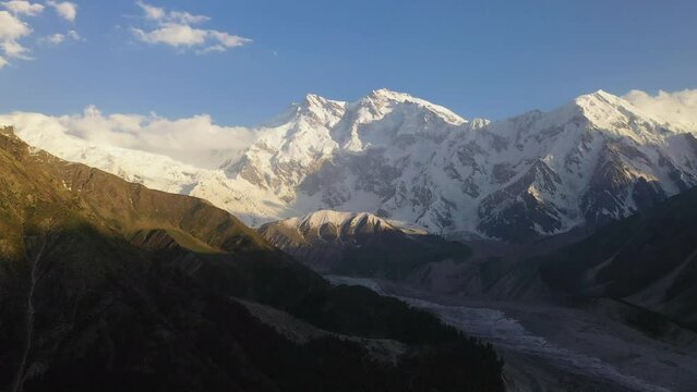 Aerial shot of Nanga Parbat with a glacier in valley, Fairy Meadows Pakistan, cinematic wide panning drone shot