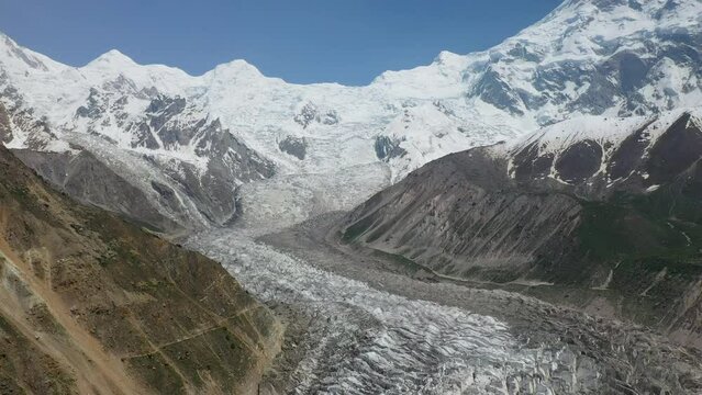 Drone shot of Nanga Parbat with a glacier in valley, Fairy Meadows Pakistan, cinematic wide revealing aerial shot