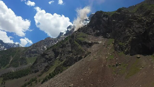 Drone shot of Nanga Parbat, Fairy Meadows Pakistan, looking up towards a mountain peak, cinematic aerial shot