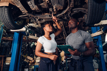 Obraz na płótnie Canvas Auto mechanic are checking and repair maintenance auto engine is problems at car repair shop.