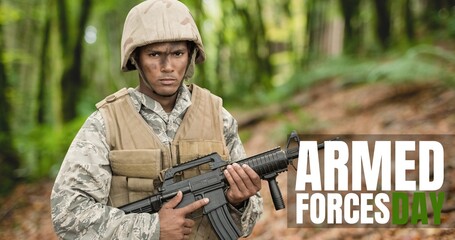Digital composite image of text over biracial young male soldier standing with rifle - Powered by Adobe