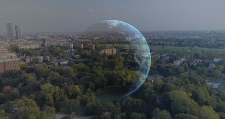 Image of social media icons and financial data processing over globe and cityscape