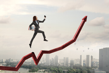 Business person climbing on red graph arrow
