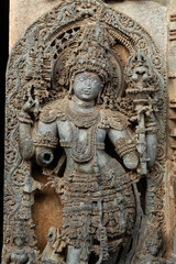 The Sculpture of Doorkeeper of Hoysaleshwara Temple, Beautiful Intricates of Ornaments, Hoysala Temple, Halebeedu, Hassan, Karnataka, India.