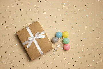A brown gift box over the brown background with copy space. 