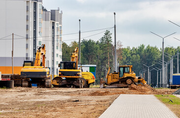 Construction site is laying new asphalt road pavement,road construction workers and road...