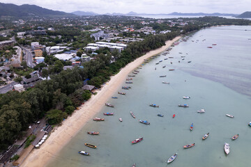 Aerial view top down longtail fishing boats at the sea in Phuket Thailand